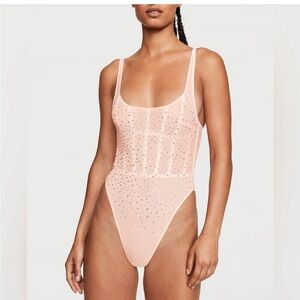 Chic Peach Bodysuit with Delicate Accents